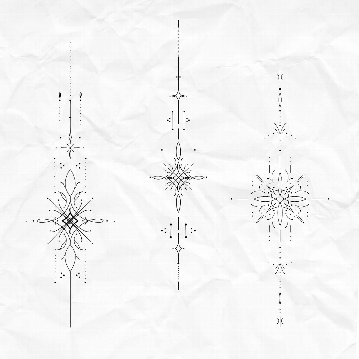 Three symmetrical geometric tattoo designs drawn in black ink on crumpled white paper.