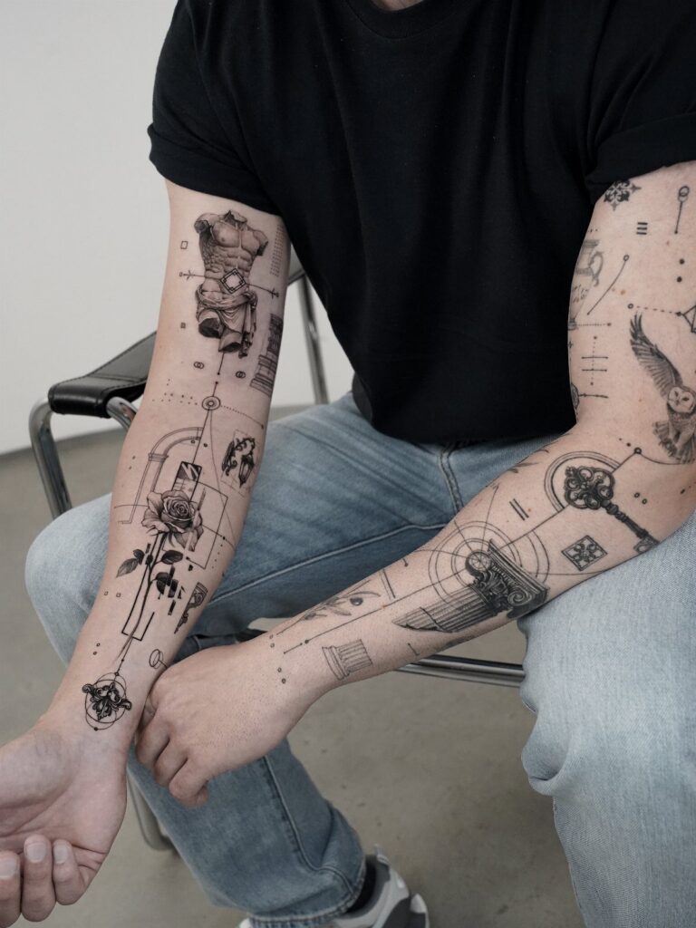 Tattooed arms of a person featuring detailed black ink illustrative sleeve designs.