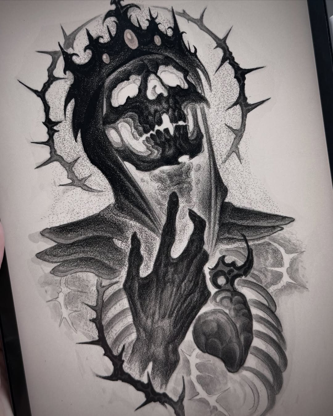 Crowned skull wearing a hood with a skeletal hand and heart in pencil drawing.